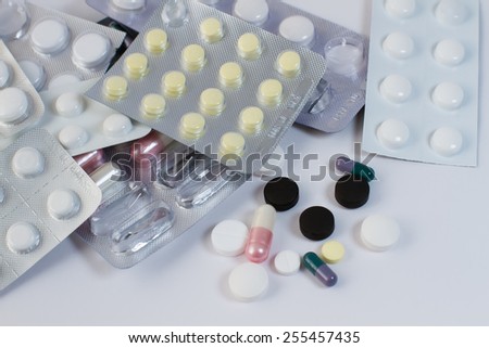 Many different tablets falling out of the frame. Health, medicine, pills, antibiotics