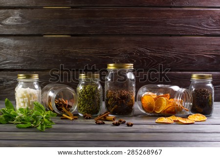 Exclusive jars with spices for tea. Fresh mint and spices.