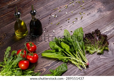 Tomato with aromatic herbs and spices. Healthy food, diet or cooking concept.