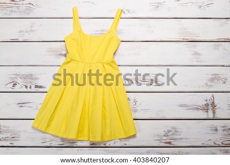 Bright summer dress. Trendy yellow sarafan.