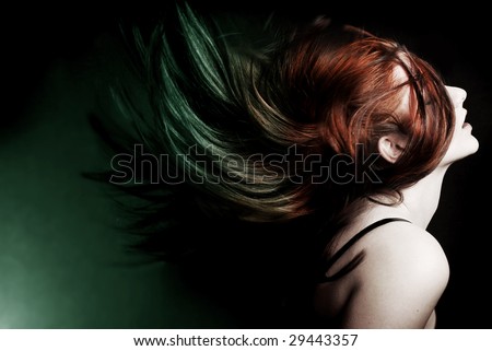 Action shot of an attractive model swinging her hair.