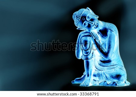 A glowing Buddha statue resting, in front of a blue abstract background with a