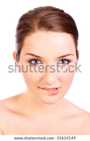 A beautiful young woman biting her lip on a white background.