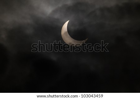 TOKYO, JAPAN - MAY 21: Annular eclipse as the moon passes the sun on May 21st 2012 in Tokyo. The first annular eclipse on earth since 1994.