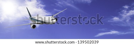 Modern 2 engine airliner banner on blue sky with a few clouds.