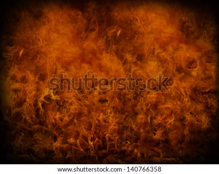 Fire background with small skulls hiding in the flames. Great for music and heavy metal styles.