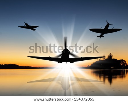 Silhouette of Vintage British World War 2 fighters flying low over a river at sunrise - Artists Impression.