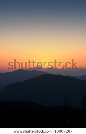 The sun setting across three valleys in central Japan