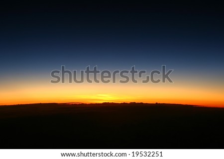 The dawn of new day showing the curve of the earth