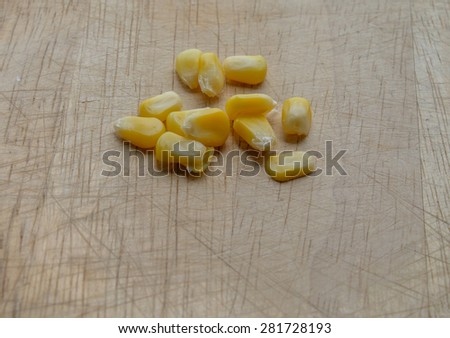 canned corn on wooden Cutting Board