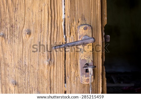 Old Door with Rusted Handle. Door Handle.