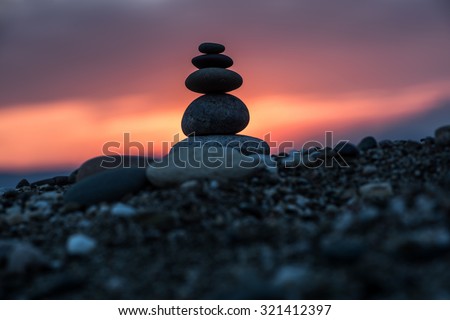 Balance stones at sunset on the beach. Balance Stones.