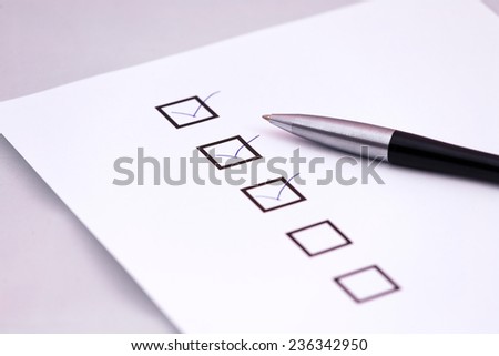 Checklist with a pen.