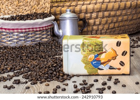 Coffee, fresh aromatic coffee beans in an old metal box with the Brazilian workers in the act of gathering coffee, composition with baskets and coffee