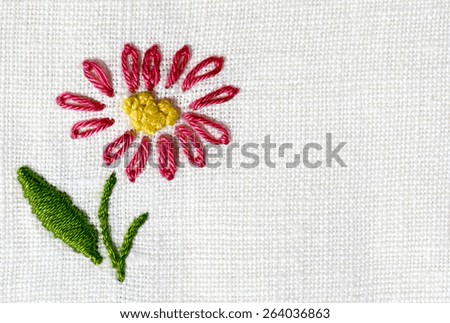 cotton fabric embroidered with flowers ,  cotton fabric embroidered  to crochet with colorful flowers ,white background, photo from above