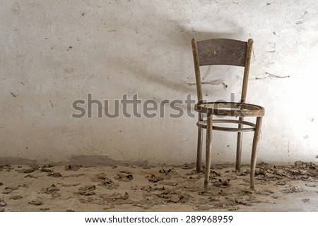 old wooden chair on white background, dust and cobwebs on the chair, natural light, front view