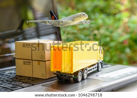 Air courier / freight forwarder or shipping service concept :  Boxes, a truck, white plane flies over a laptop, depicts customers order things from retailer sites via the internet and ship worldwide.