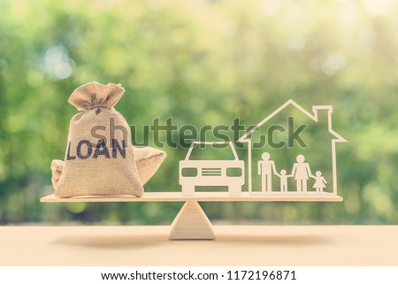 Family financial management, mortgage and payday loan or cash advance concept : Loan bags, family in a house on balance scale, depicts short term borrowing, high interest rate based on credit profile