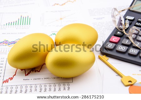 Three golden eggs and a golden key with a calculator on business and financial reports : Key success in sustainable growth investment concept