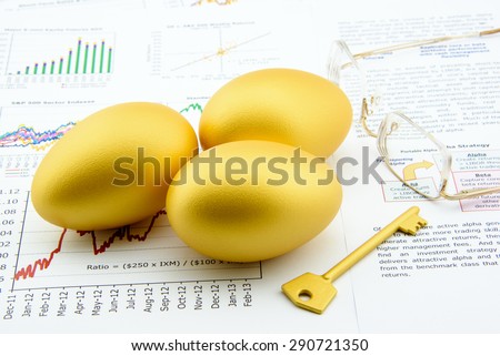 Three golden eggs with a golden key and eye glasses over business and financial summary reports. Key success in sustainable growth investment concept.
