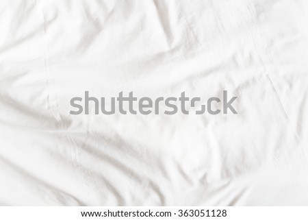 Top view of a messy bedding sheet after night sleep.