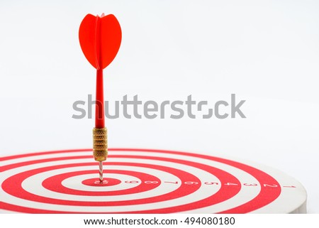 Circular target marked with numbers and red dart. An idea of targets i.e business, price, audience, market, group, practice, analysis, risk, range, rate, state, tracking, area, value, cost, site, etc.