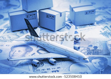 White airplane lands on notes from the most famous countries around the world with carton of goods behind. An idea of things about aviation i.e. overseas freight forwarding, express courier services.