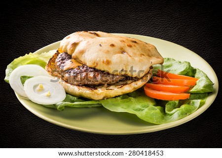 Grilled meat patty with cheese