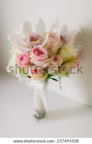 wedding bouquet  with orchids and roses on white background in fine art style