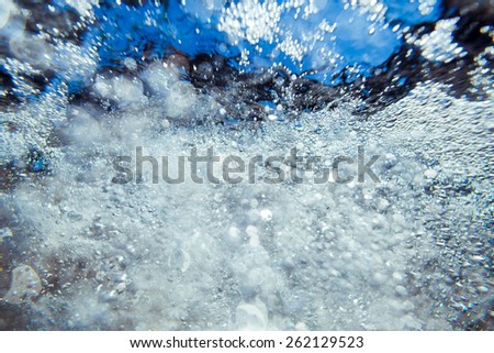 abstract underwater clear birght sea foam  bubbles and bokeh texture background