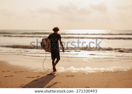 surfer man with sufing board in waves silhouette