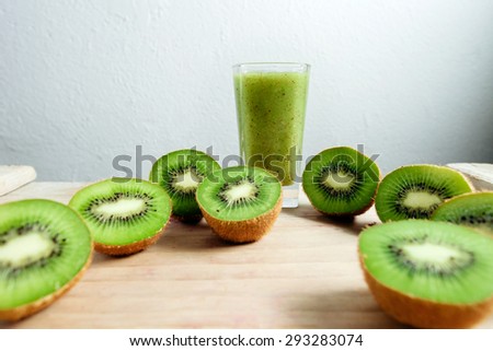 kiwi smoothie tropical fresh blended green kiwi on wood table