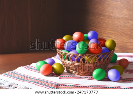 Basket of beautiful easter eggs in a woven basket. Easter stock image