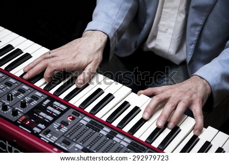 Hands of musician. Pianist playing on electric piano