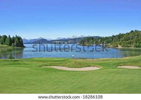 A golf filed by the lake
