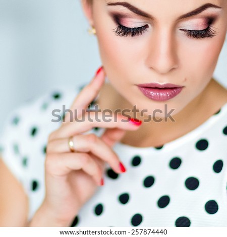 Portrait of a beautiful sexy girl brunette with closed eyes with the perfect makeup smoky eyes , close up