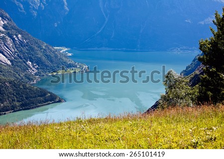 Very beautiful view of the mountain on the blue water of the fjord and mountains in Norway in the summer