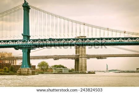 View of Manhattan Bridge, Brooklyn Bridge, and Statue of Liberty.