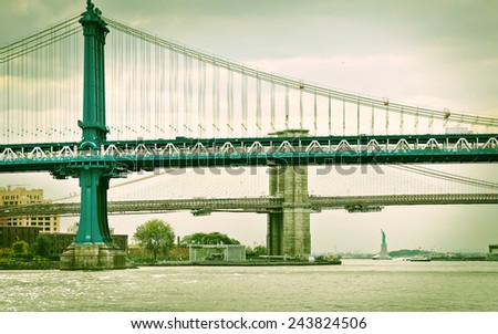 View of Manhattan Bridge, Brooklyn Bridge, and Statue of Liberty.