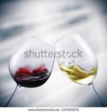 glasses of red and white wine toasting