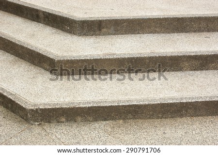 Brown concrete stairs with three steps.