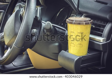 Coffee mugs yellow Placed on the vehicle console