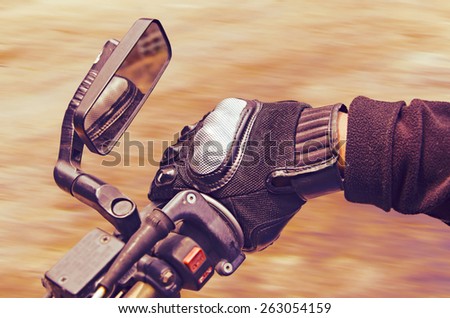 Human hand in a Motorcycle Racing Gloves
