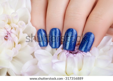 Beautiful nails and blue flower.