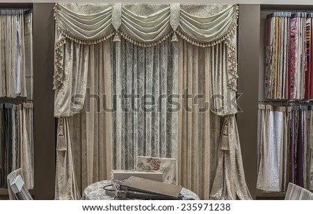 Large selection of fabrics for interior decoration. Curtains, tulle and furniture upholstery.