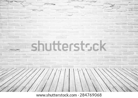Old interior room with broken white brick wall and grunge wood floor texture