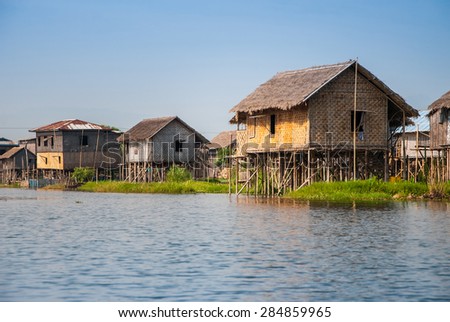 INLE LAKE, MYANMAR - APRIL 10: Floating houses in a village on APRIL 10, 2012 in Inle Lake, Myanmar. Inle lake is a famous lake for tourism in Myanmar.