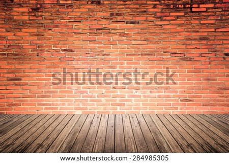 Old interior room with broken red brick wall and grunge wood floor texture