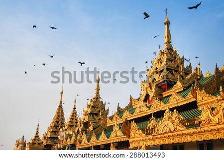 Roof of building in front of Shwedagon Pagoda, famous attraction in Myanmar (Burma). This detail is Burmese architecture style.