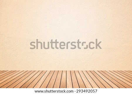 Empty room of beige cement plaster wall and brown wood floor in cream or beige tone